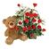 Teddy Bear & Roses. A charming teddy bear and and arrangement of tender red roses with greens in basket.. Den Haag